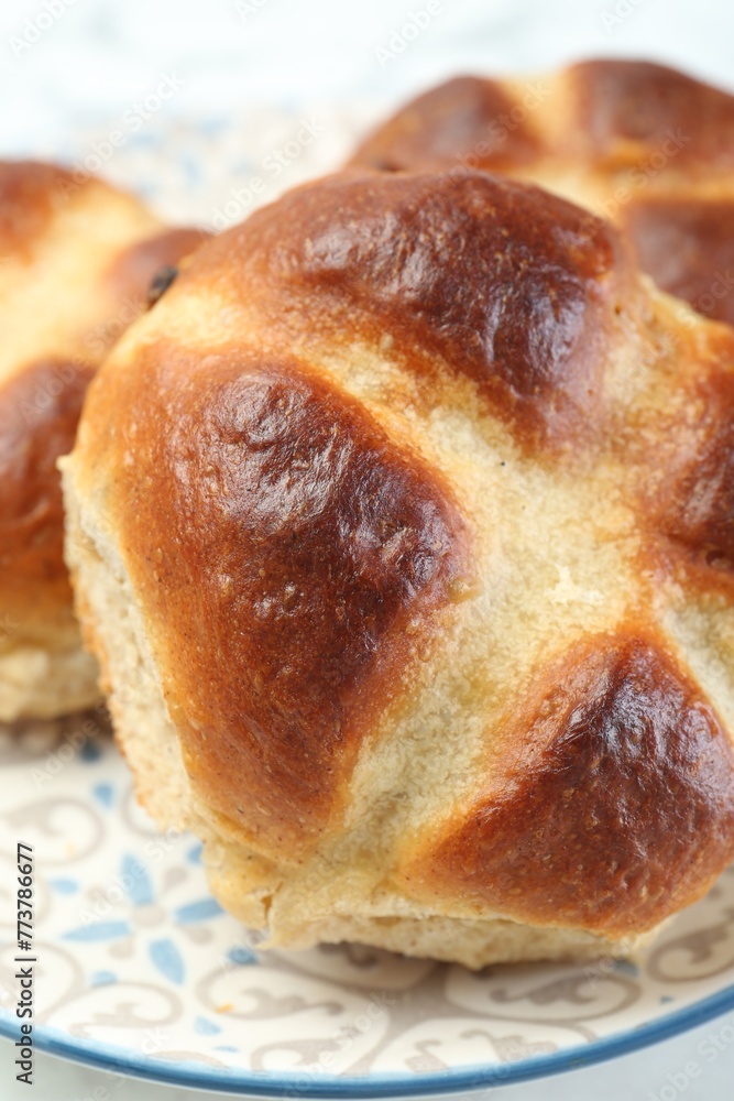 Hot cross buns on white table, closeup Hot cross buns on white table, closeup