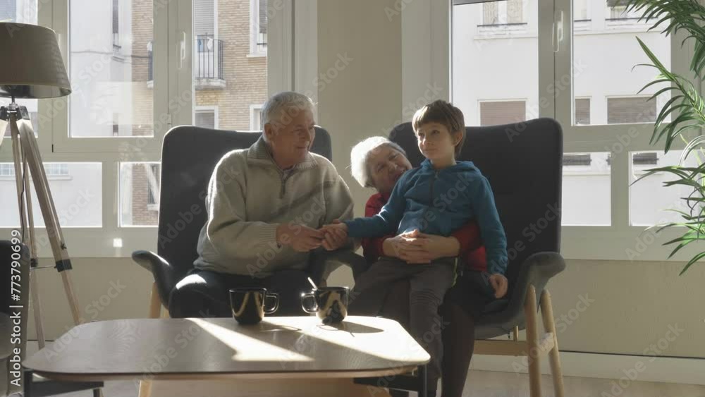 Old man and woman enjoy time with their grandson at home Old man and woman enjoy time with their grandson at home