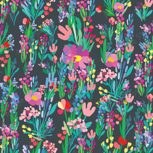 Seamless pattern of colorful flowers and leaves on a dark background. Floral textile botanical design