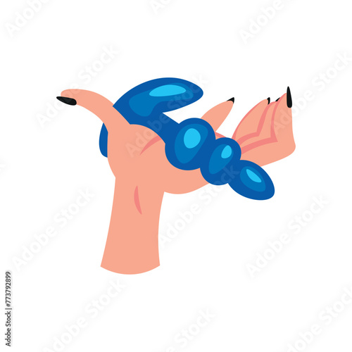 Hand holding anal sex toy on white background