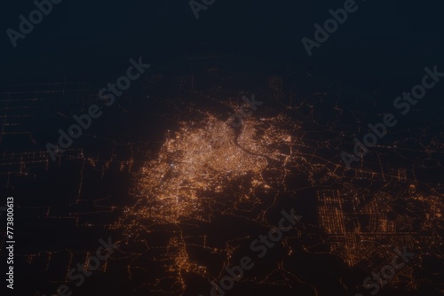 Aerial shot on Palembang (Indonesia) at night, view from west. Imitation of satellite view on modern city with street lights and glow effect. 3d render
