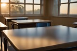 a classroom table bathed in warm evening light, set against a softly blurred background