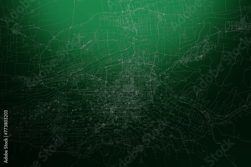 Street map of Xian (China) engraved on green metal background. Light is coming from top. 3d render, illustration