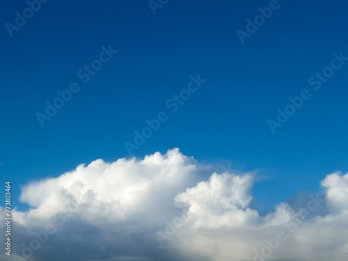 White fluffy cumulus clouds in the summer sky  natural clouds background