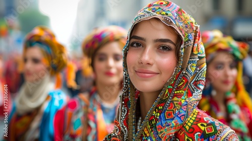 Young woman in an embellished headscarf at cultural festival with soft focus background 