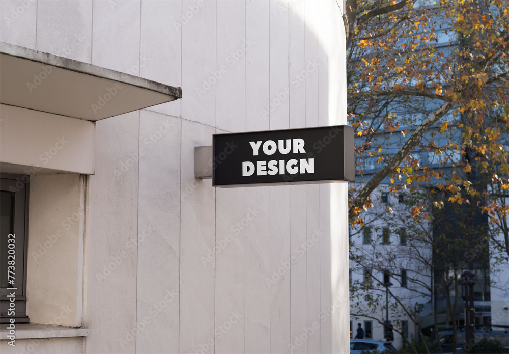 Mockup of customizable sign on building Stock Template | Adobe Stock