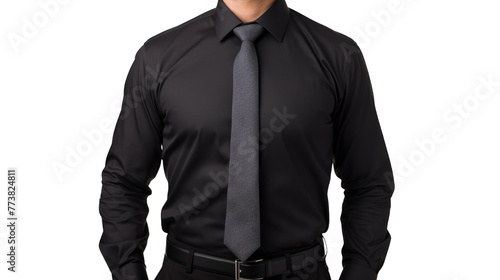 A stylish man in a black shirt and gray tie poses confidently photo