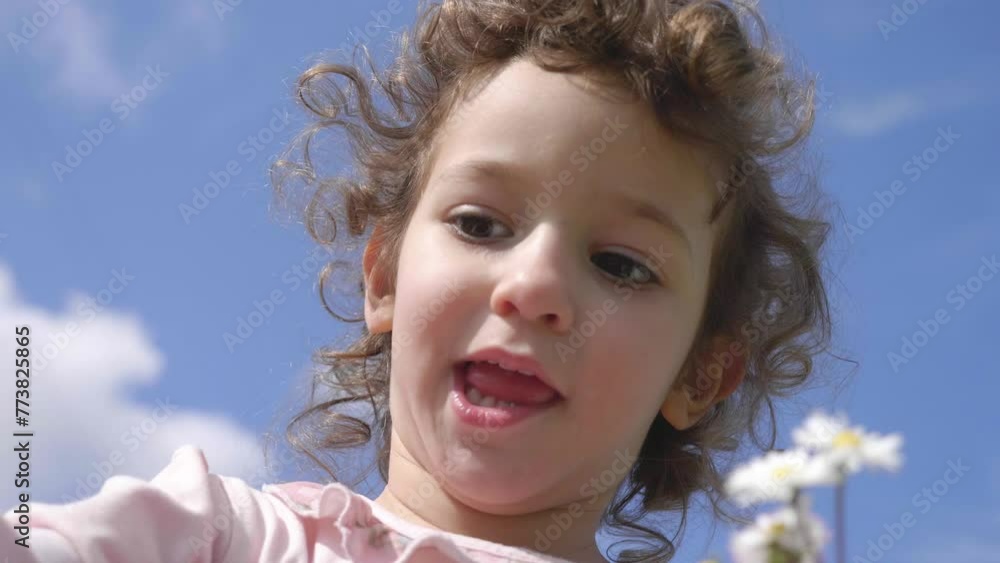 Skyward Petals: A Child's Encounter with Sky and Flower Skyward Petals: A Child's Encounter with Sky and Flower