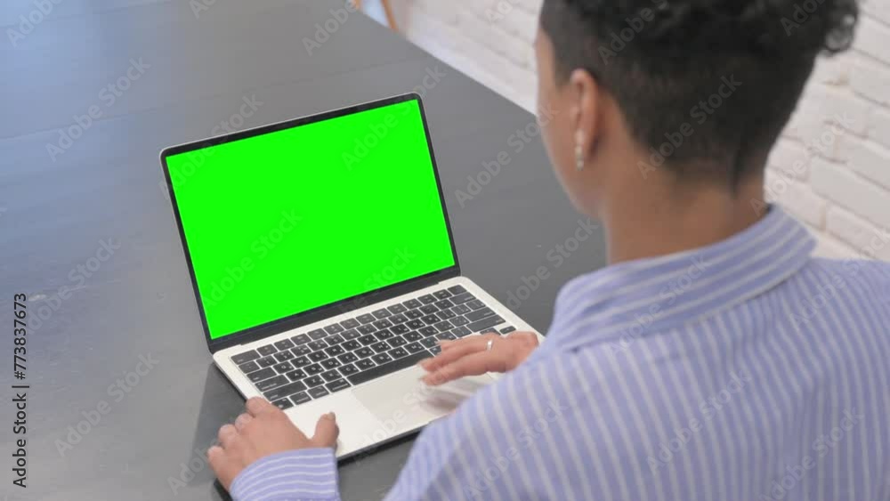 African Woman Using Laptop with Chroma Key Screen African Woman Using Laptop with Chroma Key Screen