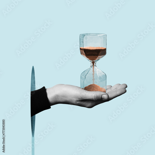 Hourglass in a human hand.  Art collage.
