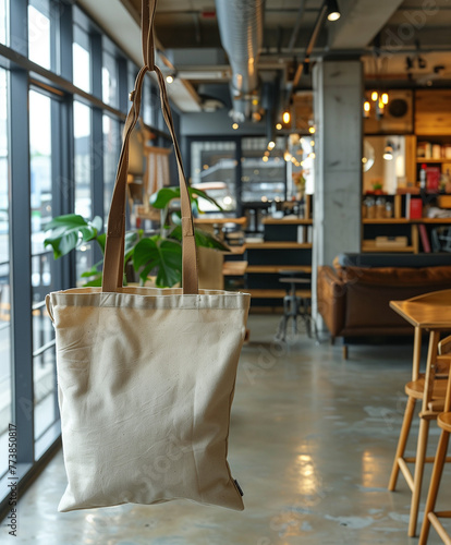 Mockup of a blank eco hemp tote bag hanging in a interior restaurant. template for organic stylish handbag.  photo