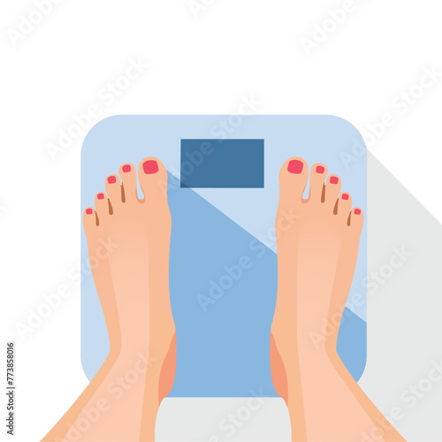 Bare feet female standing on weight scale.