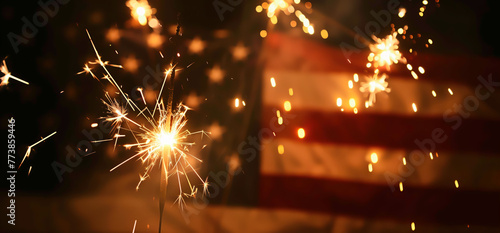 Fourth of July sparklers, independence celebration concept. Blurred stars and stripes. photo