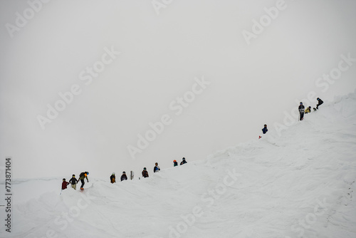 Ski, Snowboard freeride i deep powder snow. Gudauri Georgia Caucasus resort. Freeride in Caucasus mountains. Freeride snowboarding in winter. Heliboarding freeride. Riding in powder on snowborad. photo