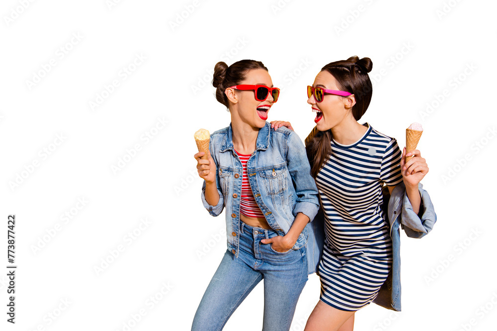 Photo of two brunette hair lady in glasses spectacles isolated on yellow background hold sugar tasty yummy delicious sweet appetiser snack in hands look each other make beaming hollywood toothy smile Photo of two brunette hair lady in glasses spectacles isolated on yellow background hold sugar tasty yummy delicious sweet appetiser snack in hands look each other make beaming hollywood toothy smile
