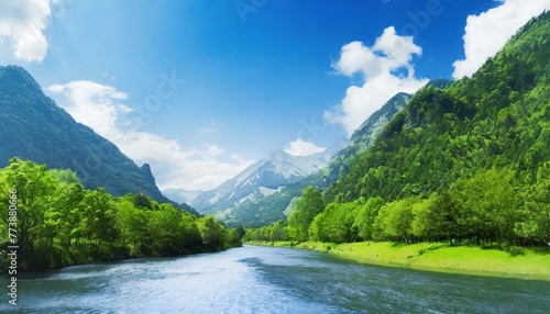 Vibrant nature scenery with mountains, trees, and river during daytime