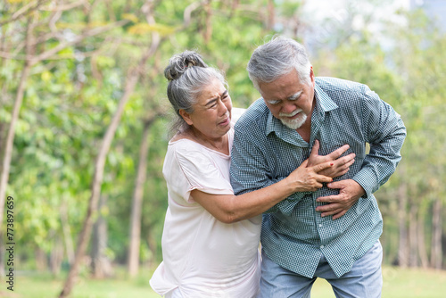 asian senior man suffering and having chest pain from heart attack in the park © offsuperphoto