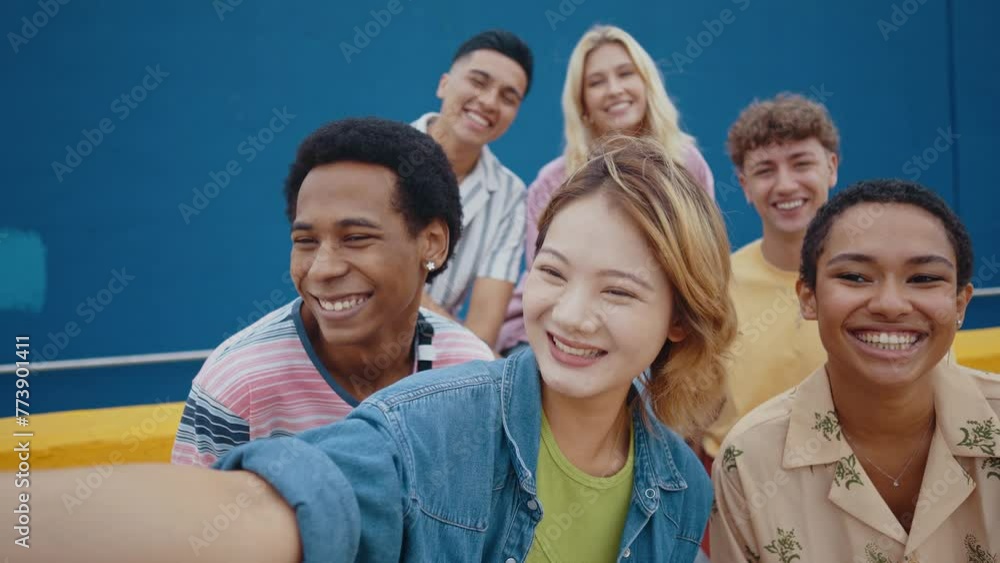 Multicultural group of teenager spending time outdoor. Multiethnic Generation z teens having fun together. Concepts about friendship and social gathering. Multicultural group of teenager spending time outdoor. Multiethnic Generation z teens having fun together. Concepts about friendship and social gathering.
