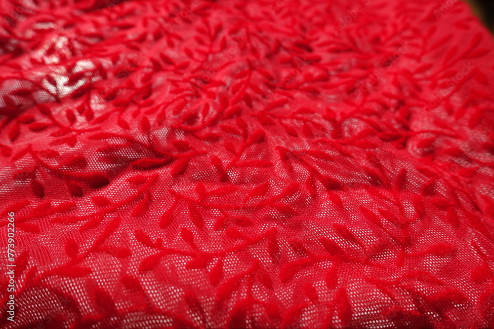 Macro of semi-transparent scarlet red burnout velvet fabric Macro of semi-transparent scarlet red burnout velvet fabric
