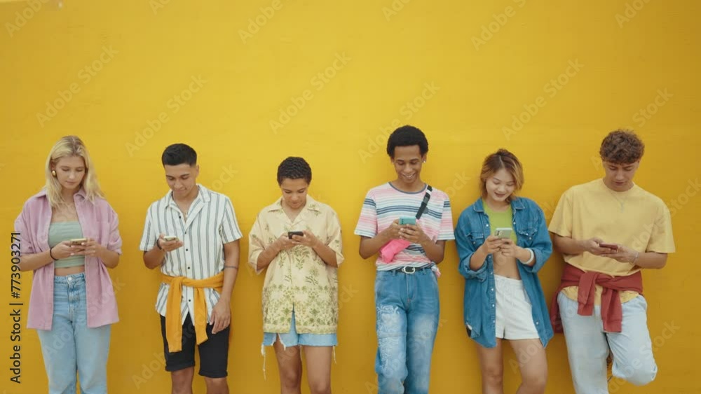 Multicultural group of teenager spending time outdoor. Multiethnic Generation z teens having fun together. Concepts about friendship and social gathering. Multicultural group of teenager spending time outdoor. Multiethnic Generation z teens having fun together. Concepts about friendship and social gathering.