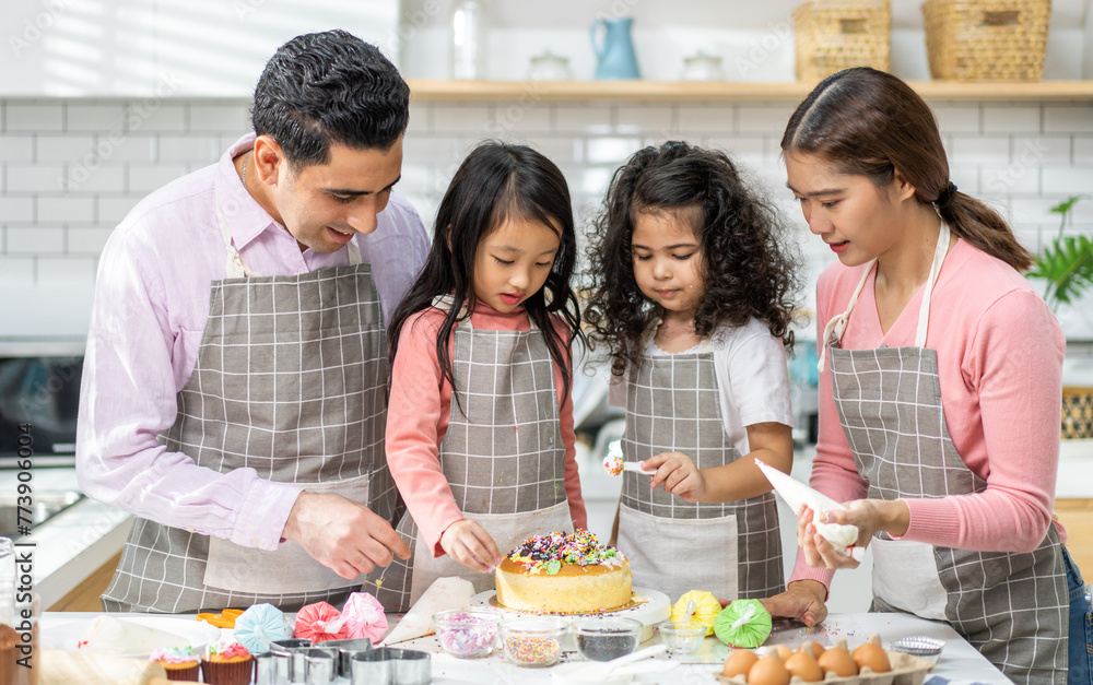 Portrait of enjoy happy love asian family father and mother with little asian girl daughter child play and having fun cooking food together with baking cookie and cake ingredient in kitchen Portrait of enjoy happy love asian family father and mother with little asian girl daughter child play and having fun cooking food together with baking cookie and cake ingredient in kitchen