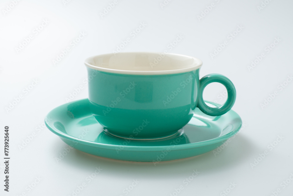 Empty coffee cup for cappuccino with latte art isolated on white background. Beautiful hot design in cafe shop, greenery ceramic cup stylish place for text. Blue ceramic mug for espresso, milk or tea Empty coffee cup for cappuccino with latte art isolated on white background. Beautiful hot design in cafe shop, greenery ceramic cup stylish place for text. Blue ceramic mug for espresso, milk or tea
