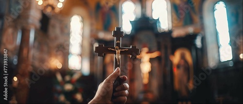Devout moment captured with a hand holding a cross during catholic mass in a church photo