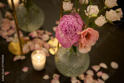 Decoration with paper flowers in a warm evening atmosphere with candles