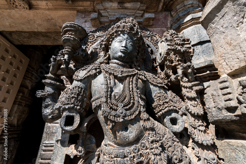 An ornate sculpture of a Dwarapala  gatekeeper  at the entrance to the ancient Hoysaleshwara temple complex in Halebidu in Karnataka.