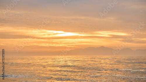 Beautiful Sunrise Morning Over Beach And Sea Looking Towards Mountains In South Africa © Monkey Business
