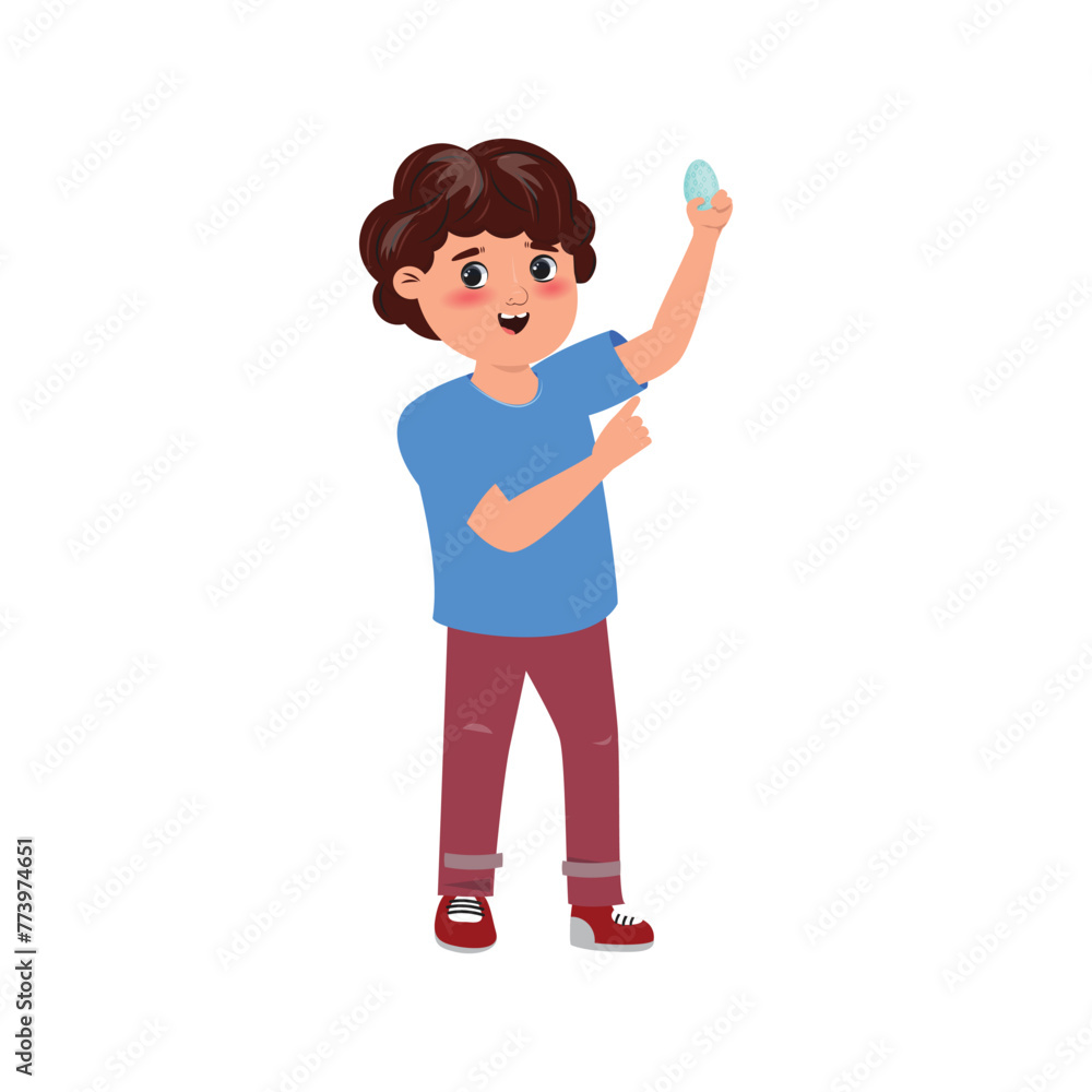 Boy holding up a painted easter egg Boy holding up a painted easter egg