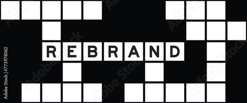 Alphabet letter in word rebrand on crossword puzzle background