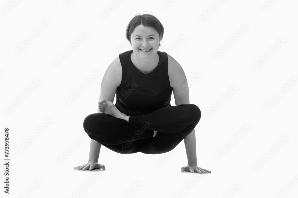 Utpluthih asana, Ashtanga yoga Side view of woman wearing sportswear doing Yoga exercise against white background. Black and white image. Utpluthih asana, Ashtanga yoga Side view of woman wearing sportswear doing Yoga exercise against white background. Black and white image.