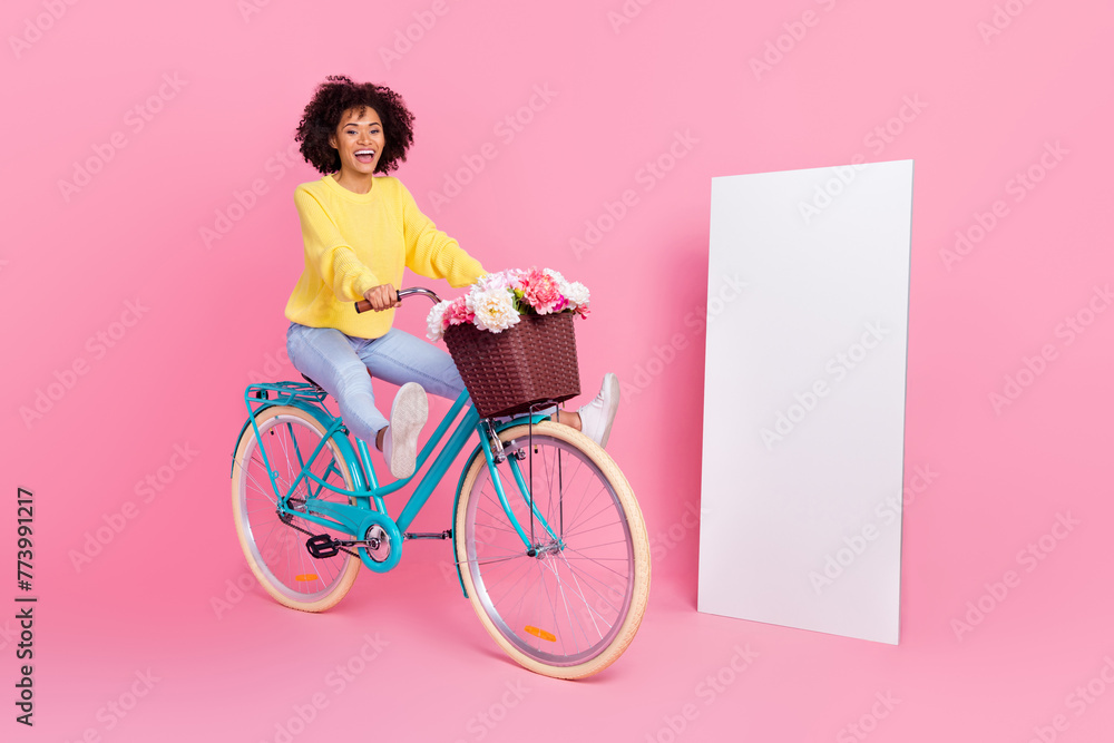 Full length profile side photo of young cheerful girl have fun ride bicycle free-time isolated over pink color background - obrazy, fototapety, plakaty 