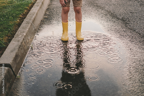 boy playing in puddles 