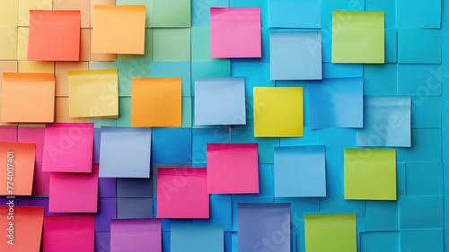 Colorful sticky notes on a blue board  with varied hues ranging from orange to pink and green