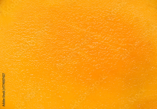 Mango texture background, yellow mango pulp close up © Alex
