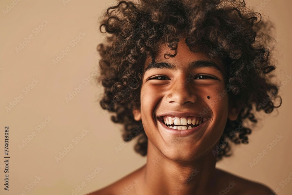 a smiling boy with curly hair a smiling boy with curly hair