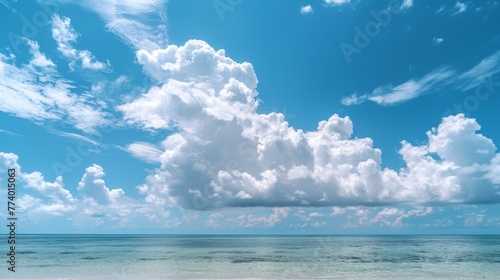 Beautiful tropical empty beach sea ocean with white cloud on blue sky background 