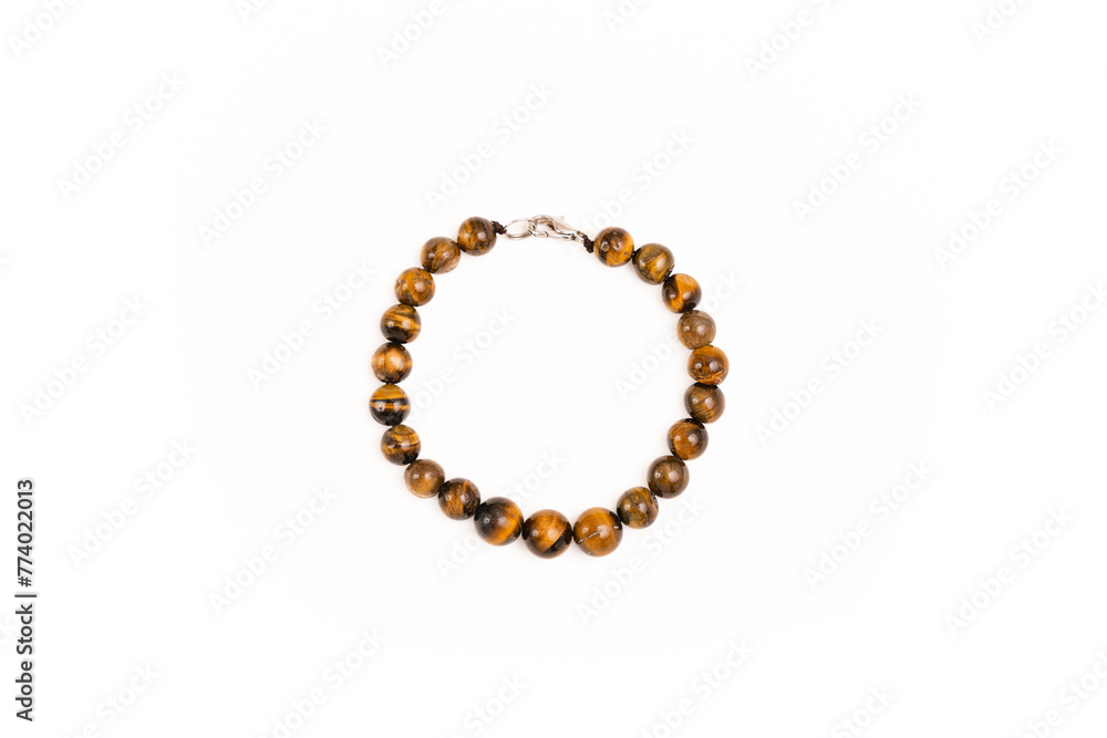 Tiger eye stone bracelet on a white background Tiger eye stone bracelet on a white background
