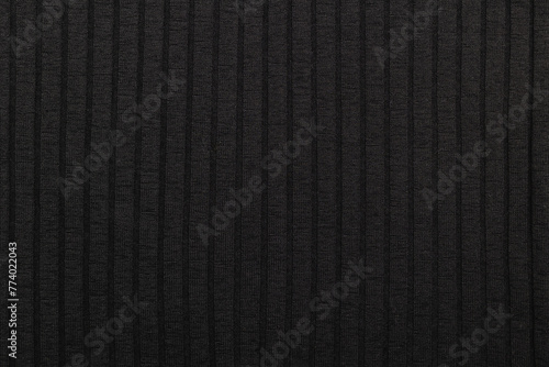 Black stretch fabric with stripes. Texture of black stretch fabric. © Olena