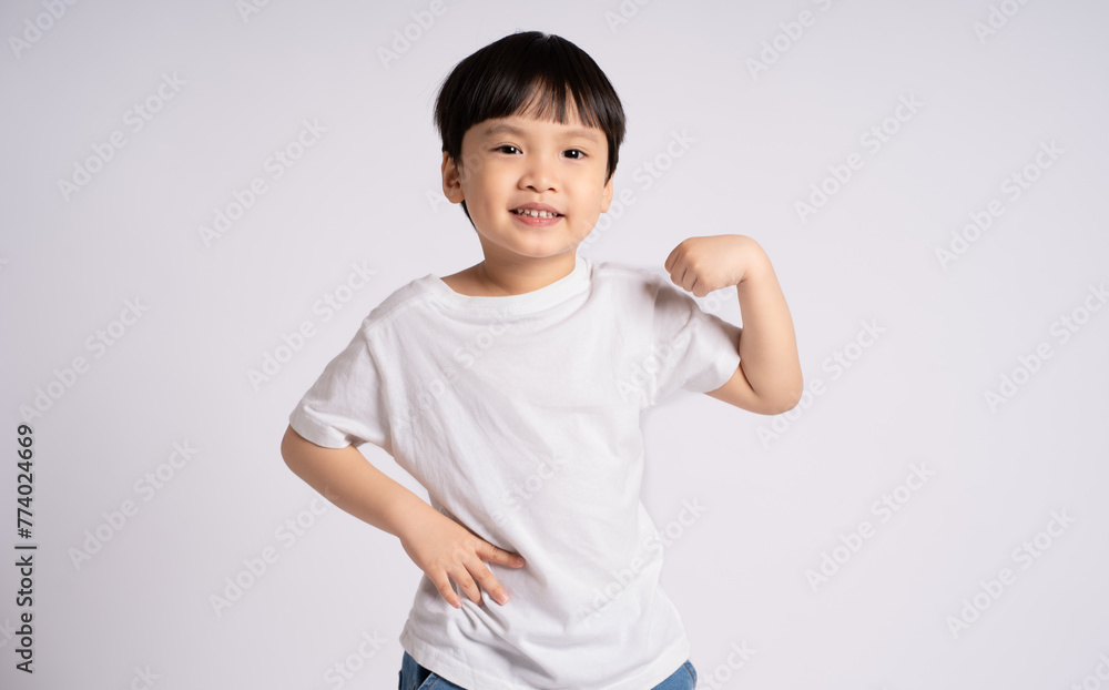Portrait of an Asian boy posing on the white background Portrait of an Asian boy posing on the white background