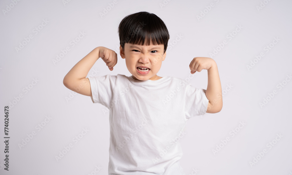 Portrait of an Asian boy posing on the white background Portrait of an Asian boy posing on the white background