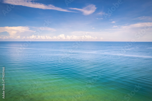 Serene green and blue waters of the ocean. Naples Beach, Florida © Wirestock