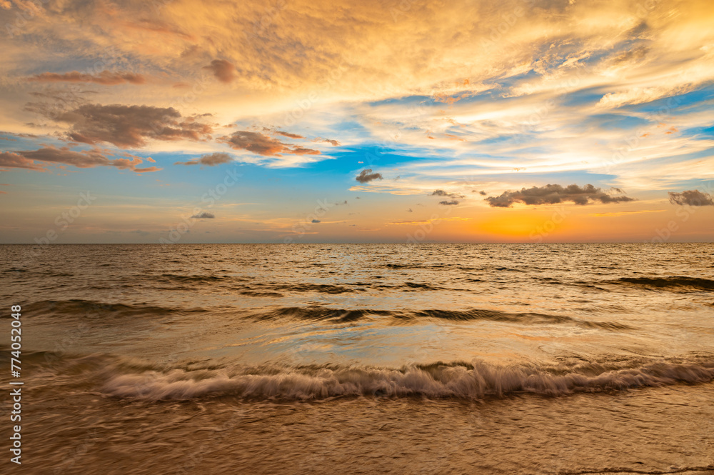 Golden sunset over the serene ocean. Naples Beach, Florida