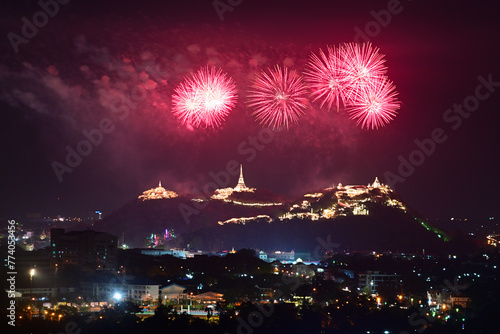 Beautiful and colorful fireworks over the palace on the small hill. © chakorn