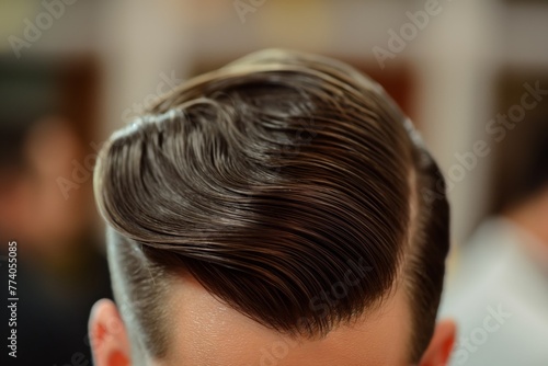 Close-up of a man's classic side part hairstyle with detailed comb lines and a clean finish