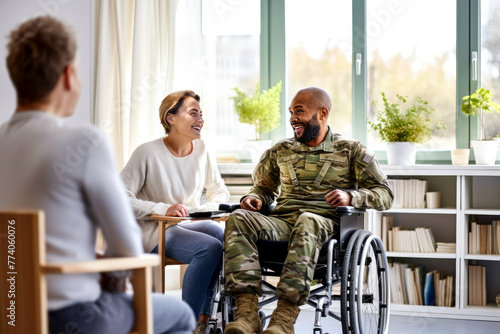 African American veteran in wheelchair and military uniform with his spouse at rehabilitation center. Concept of importance support and mental health, physical, and emotional wellness, togetherness photo