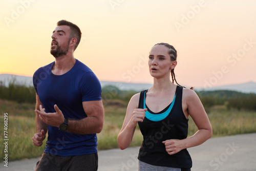 Fototapeta Naklejka Na Ścianę i Meble -  Dynamic Duo: Fitness-Ready Couple Embraces Confidence and Preparation for Upcoming Marathons