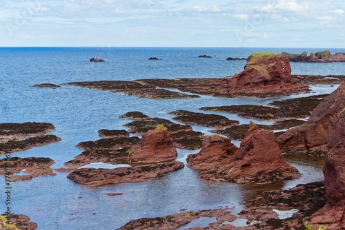 High angle shot of stone formations on the shore of North Berwick, Scotland, UK photo